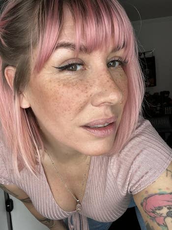 Person showing freckles on their face after using a freckle stamp
