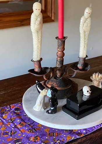 the frankenstein monster and bride salt and pepper shakers on a reviewer's dining table centerpiece display