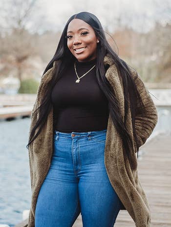 reviewer wearing the coat in brown