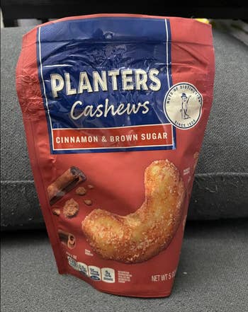 Planters Cashews bag featuring cinnamon and brown sugar flavor with an image of a coated cashew