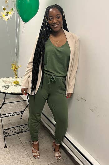 Reviewer wearing the military green jumpsuit