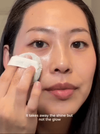 Person applying a skincare product with a cotton pad, text reads: 
