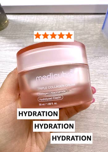 Hand holding Medicube Triple Collagen Cream jar, labeled with collagen, niacinamide, and hydrolyzed elastin, plus 