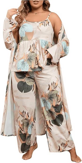 A model wearing a flowing, floral-patterned loungewear set
