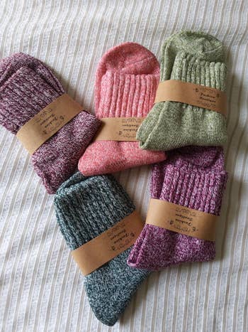 The socks in pink, purple, green, and blue pairs 