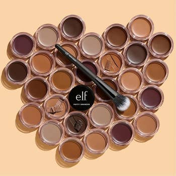 Different shades of e.l.f. Putty Bronzer arranged with a makeup brush on top