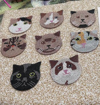 DIamond painted coasters in the shape of cat faces