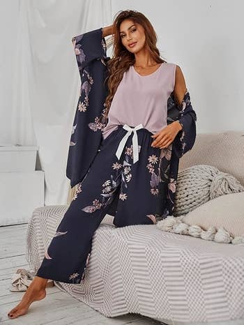 A model lounging on a sofa in floral loungewear set