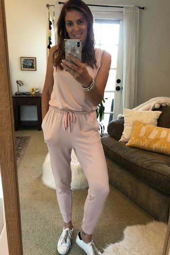 Reviewer wearing the light pink jumpsuit