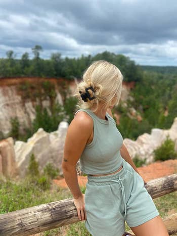 reviewer wearing light green outfit set